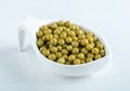Close up photo of marinated olives in white bowl over white background Royalty Free Stock Photo