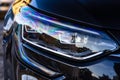 Close up photo of modern car, detail of headlight. Headlight car Projector LED of a modern luxury technology and auto detail Royalty Free Stock Photo