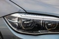 Close up photo of modern and clean car, detail of headlight. Headlight car Projector/LED of a modern luxury technology and auto Royalty Free Stock Photo