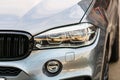 Close up photo of modern and clean car, detail of headlight. Headlight car Projector/LED of a modern luxury technology and auto Royalty Free Stock Photo