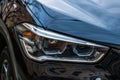 Close up photo of modern and clean car, detail of headlight. Headlight car Projector/LED of a modern luxury technology and auto Royalty Free Stock Photo