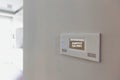 Close up photo of modern energy saving touch switch board on wall