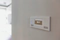 Close up photo of modern temperature touch switch board on wall