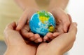 mother and daughter holding world globe in eduction and protecti Royalty Free Stock Photo