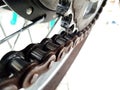 Close-up photo of a motorbike chain and gears