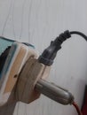 Close-up photo of a nearly dislodged outlet