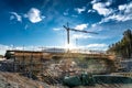 Close up photo of new bridge building site with timbering construction for further filling it with concrete. Yellow crane tower, Royalty Free Stock Photo