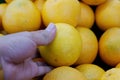 Close-up photo of an orange being held