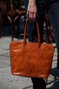 close-up photo of orange leather bag in a woman& x27;s hand Royalty Free Stock Photo