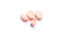 Close-up photo of orange pills isolated on white background Royalty Free Stock Photo