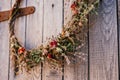 Close up photo, part of twisted natural creative dry herbal wreath from twigs of wild flowers. Thanksgiving holiday