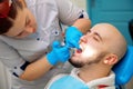 Close up photo of patient on the examination of the teeth at the