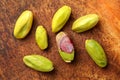 Close up photo - peeled green pistachios on wooden board. View f Royalty Free Stock Photo