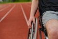 Close up photo of a person with disability in a wheelchair training tirelessly on the track in preparation for the Royalty Free Stock Photo