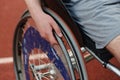 Close up photo of a person with disability in a wheelchair training tirelessly on the track in preparation for the Royalty Free Stock Photo