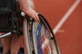 Close up photo of a person with disability in a wheelchair training tirelessly on the track in preparation for the Royalty Free Stock Photo