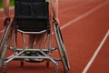 Close up photo of a person with disability in a wheelchair training tirelessly on the track in preparation for the Royalty Free Stock Photo