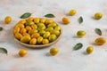 Close up photo, Pile of kumquats on wooden plate