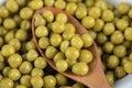 Close up photo of pile of marinated green olives Royalty Free Stock Photo