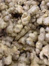 Close up photo of a pile of ginger in supermarket