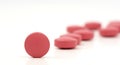 Close-up photo of pink orange pills isolated on white background Royalty Free Stock Photo