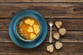 Close-up photo of the plate with fresh homemade pumpkin cream soup with seeds and heart shape toasts Royalty Free Stock Photo