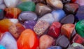 Close-up photo of polished gemstones. Colorful gemstones background.