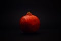 Pomegranate on a black background