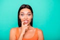 Close up photo portrait of depressed negative expressing nervous girl biting nails damaging new manicure isolated pastel Royalty Free Stock Photo