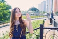 Close-up photo portrait of sweet charming with nice hairstyle lady waving palm to girlfriend standing near railings looking up to
