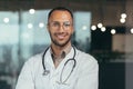 Close-up photo. Portrait of a young male hispanic doctor. Standing in a white coat and a stethoscope Royalty Free Stock Photo