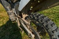Close up photo of a professional motocross rider in action, showcasing the tire and various components of the motorcycle Royalty Free Stock Photo