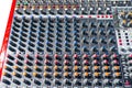 Close up photo of a professional sound mixer with many adjustments, knob switches and buttons of audio mixer control panel. Royalty Free Stock Photo