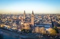 A close up photo of a public monocular on the top of a mountain with spectacular aerial views of the old city of Verona in Italy.