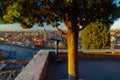 A close up photo of a public monocular on the top of a mountain with spectacular aerial views of the old city of Verona in Italy.