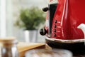 Close up photo of a red toaster on a kitchen table Royalty Free Stock Photo