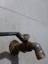 Close up photo of rusty water faucet