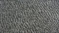 Close-up photo of Sand of beach with a unique and intricate pattern. The pattern on the floor is reminiscent of veins or sinews, Royalty Free Stock Photo