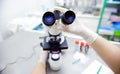 Close-up photo of scientist hands with microscope, examining sam Royalty Free Stock Photo