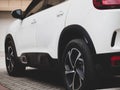 A close-up photo of the scratch-resistant plastic trim and tires on the right side of the Citroen C5 aircross SUV