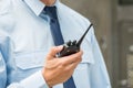 Security Guard Holding Walkie-talkie