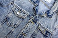 Close-up photo of several elements of a beautiful and fashionable denim jacket.