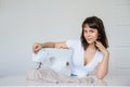 Photo of a sexy brunette working at the sewing machine Royalty Free Stock Photo
