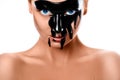Close up photo of woman with black paint on face