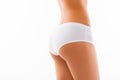 Close up photo of shapely woman`s back in white panties