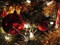 Close-up photo of shining red balls and other decorations