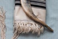 A close-up photo of a shofar and tallit,