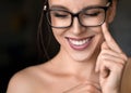 Close up photo of a happy smiling woman in eyeglasses. Eyesight health concept.