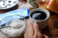 Close-up photo of someone drinking tea in the front yard of his house Royalty Free Stock Photo