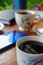 Close-up photo of someone drinking tea in the front yard of his house Royalty Free Stock Photo